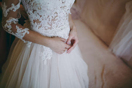 arms and legHands and feet of the bride. Close-ups, hands together, fingerssの写真素材