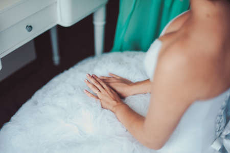 arms and legHands and feet of the bride. Close-ups, hands together, fingerss