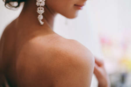Bride and earrings. Beautiful jewelry for the brideの写真素材