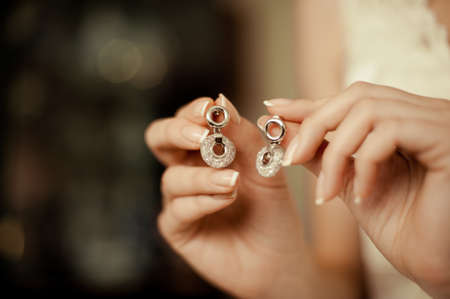 Bride and earrings. Beautiful jewelry for the brideの写真素材
