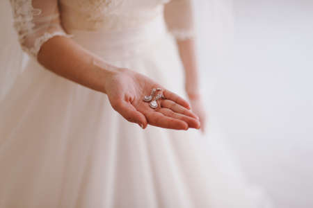 Bride and earrings. Beautiful jewelry for the brideの写真素材