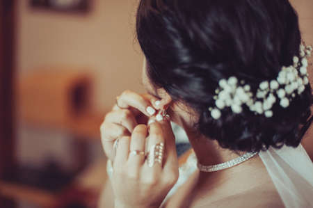 Bride and earrings. Beautiful jewelry for the brideの写真素材