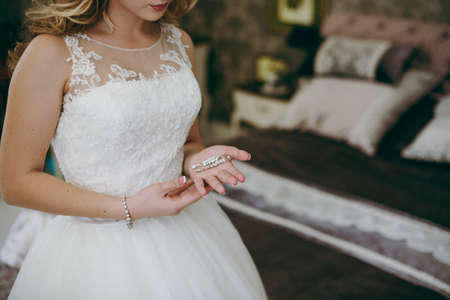 Bride and earrings. Beautiful jewelry for the brideの写真素材