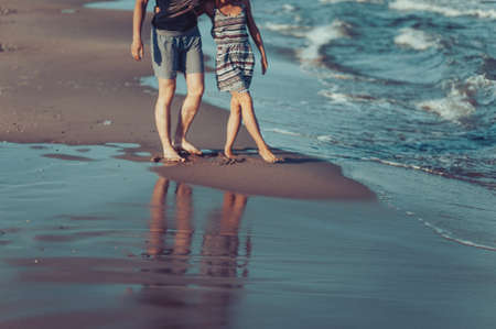 The feet of lovers on the beachの写真素材