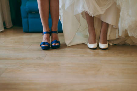 Bride Putting On Wedding Shoesの写真素材