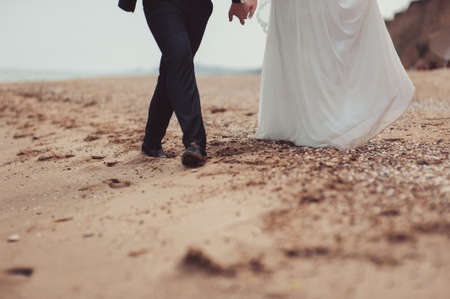 Groom and bride on the beachの写真素材