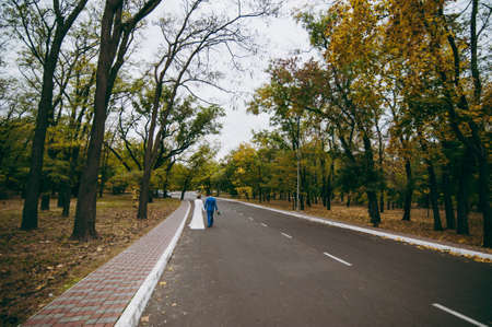 Wedding couple bride and groom on a walkの写真素材