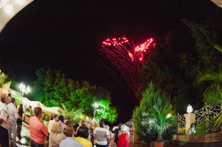Wedding fireworks. Bride and groom hugging in the night on firework and salute background, wedding partyの写真素材