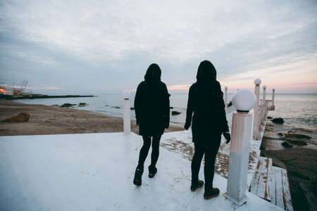 People on the beach near the sea meet the dawnの写真素材