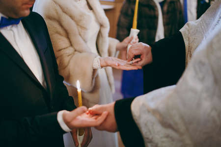Putting on rings. The bride and groom dress ringsの写真素材