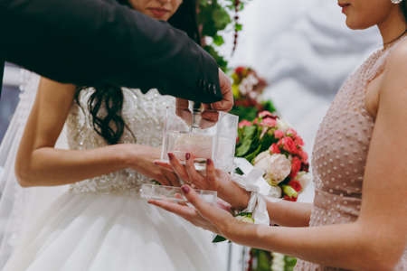 Putting on rings. The bride and groom dress ringsの写真素材