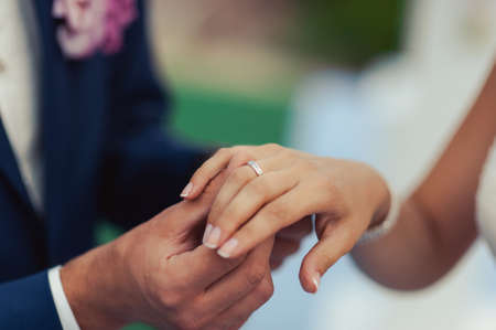 Putting on rings. The bride and groom dress ringsの写真素材