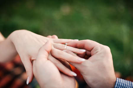 Putting on rings. The bride and groom dress ringsの写真素材