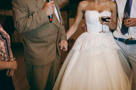A father holds his daughter's handsの写真素材