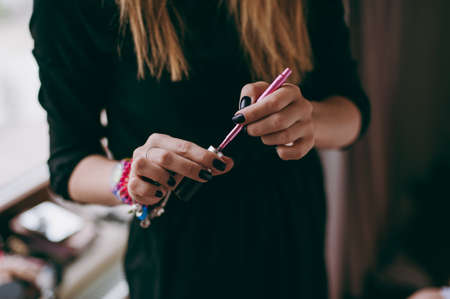 Young beautiful asian woman applying make-up by make-up artistの写真素材