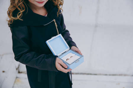 little girl or boy Carrying Wedding Ring On Cushion