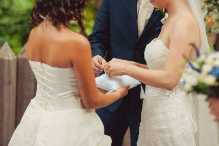little girl or boy Carrying Wedding Ring On Cushionの写真素材