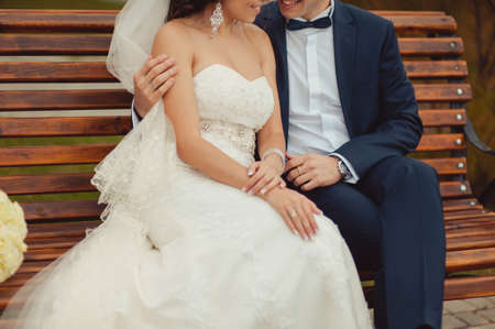 Close-up of a bride and groom in an embrace.の写真素材