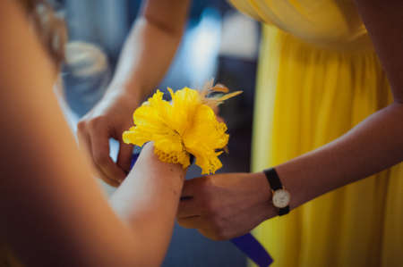 Flower on hand of the bridesmaids at the weddingの写真素材