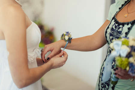 Flower on hand of the bridesmaids at the weddingの写真素材