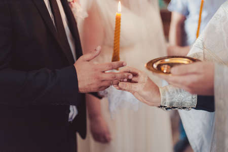 Putting on rings. The bride and groom dress ringsの写真素材