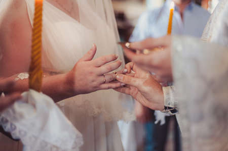 Putting on rings. The bride and groom dress ringsの写真素材