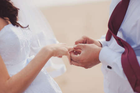 Putting on rings. The bride and groom dress ringsの写真素材
