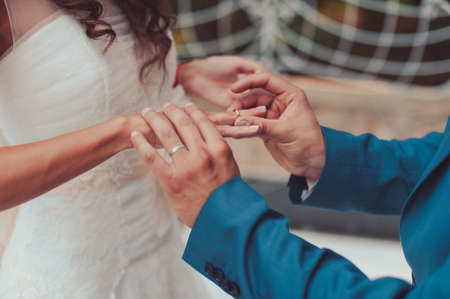 Putting on rings. The bride and groom dress ringsの写真素材