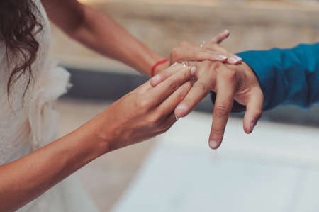Putting on rings. The bride and groom dress ringsの写真素材