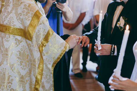 Putting on rings. The bride and groom dress ringsの写真素材