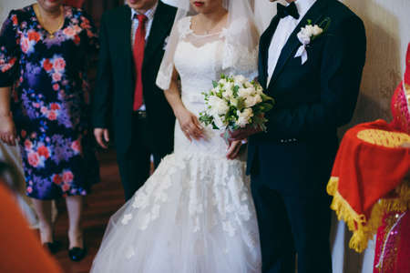 Holding hands. Closeup view of married couple holding handsの写真素材