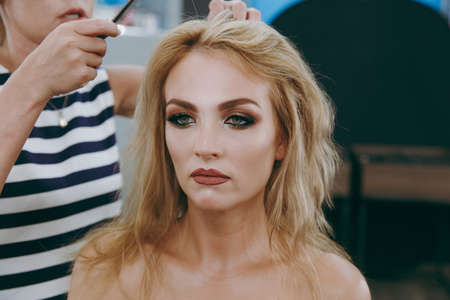 Make-up and hairstyle for a modelの写真素材