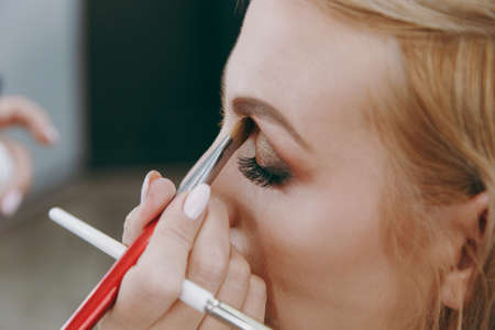 Make-up and hairstyle for a model