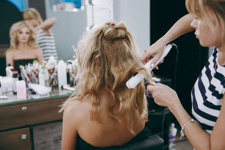 Make-up and hairstyle for a modelの写真素材