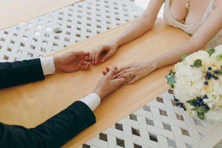 Beautiful wedding celebration. Bride in beautiful elegant lace wedding dress and bridegroom in black...