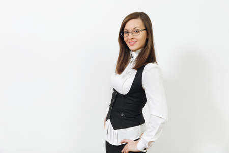 Beautiful happy caucasian young smiling brown-hair business woman in black suit, white shirt and glasses looking camera isolated on white background. Manager or worker. Copy space for advertisementの写真素材