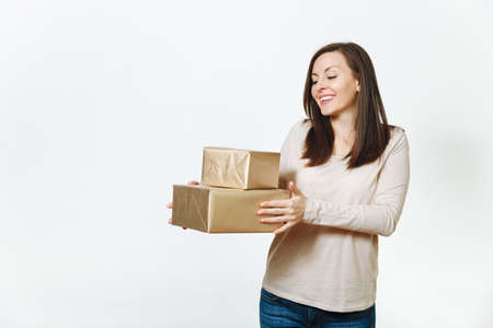 Pretty caucasian fun young happy woman in light clothes with shy charming smile, brown hair and two...