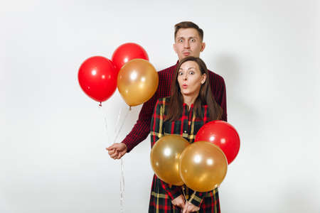 Beautiful caucasian young happy smiling couple in love. Woman and man in plaid checkered clothes...