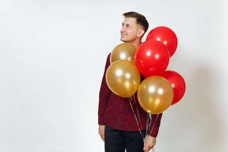 Handsome caucasian smiling fun young happy man 25-30 years in red plaid shirt with yellow golden...