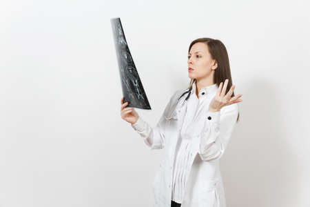 Intellectual doctor woman holds x-ray radiographic image ct scan mri isolated on white background. Female doctor in medical gown stethoscope Healthcare personnel medicine concept Radiology departmentの写真素材