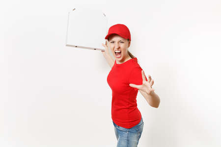 Delivery woman in red uniform isolated on white background. Pretty female in cap, t-shirt, jeans working as courier or dealer holding italian pizza in cardboard flatbox. Copy space for advertisementの写真素材