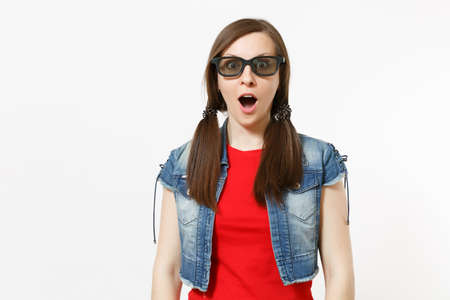 Portrait of young shocked attractive brunette woman with opened mouth in 3d glasses and casual clothes watching movie, film isolated in studio on white background. Emotions in cinema conceptの写真素材