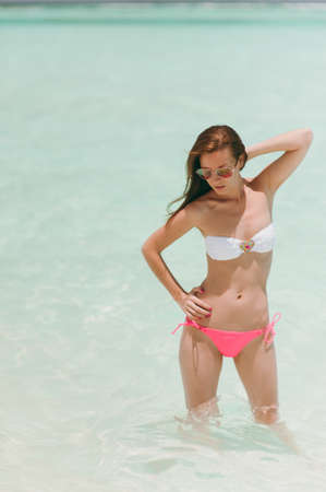 The beautiful girl on the beach on the islandの写真素材