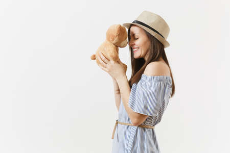 Young tender elegant charming woman dressed blue dress, cute hat with long brunette hair posing...