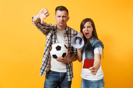 Angry fun expessive crazy couple, woman man football fans screaming, cheer up support team with...