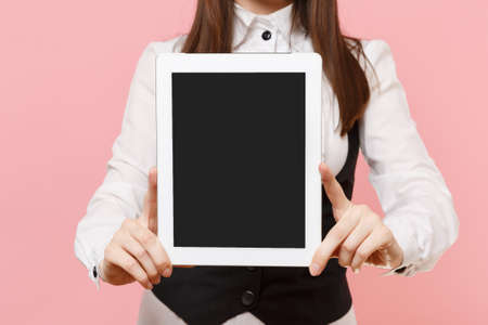 Close up of smiling business woman holding tablet pc computer with blank empty screen isolated on...