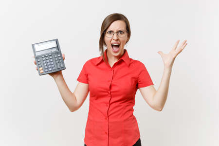 Portrait of business teacher or accountant woman in red shirt, glasses holding calculator in hands isolated on white background. Education teaching in high school university, accounting count conceptの写真素材