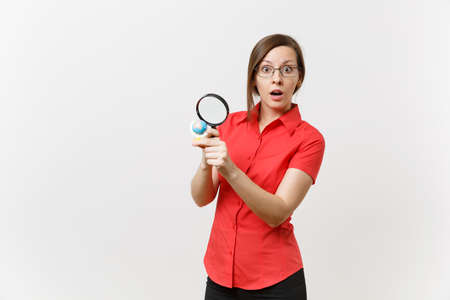 Portrait of business teacher woman in red shirt holding and looking through magnifying glass on...