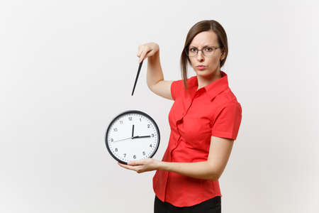 Young smart business teacher woman in red shirt glasses holding round clock, wooden classroom pointer on copy space isolated on white background. Education teaching in high school university conceptの写真素材