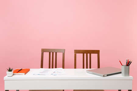 Office light interior of workplace, table with modern laptop pc computer documents orange notebook...